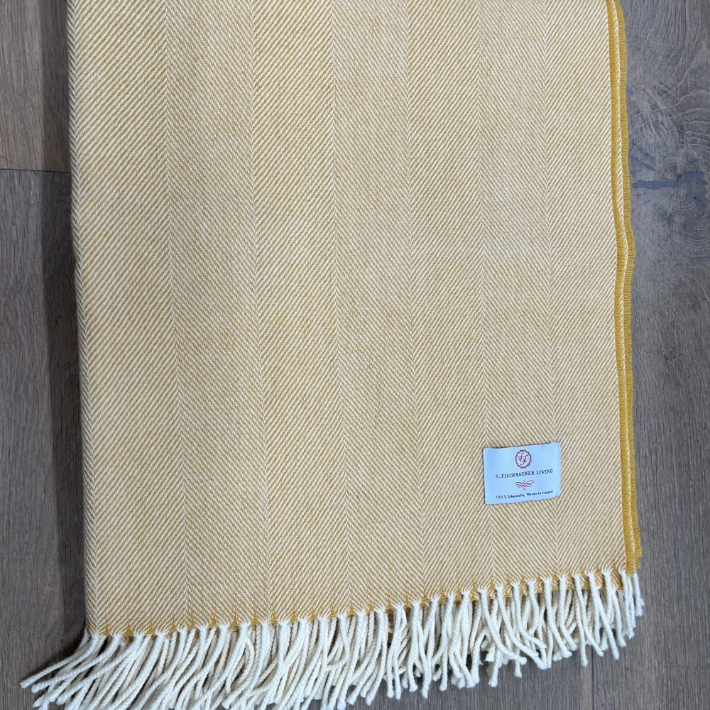 Plaid Cosy Lambswool - Kurkuma Latte Gelbe Wolldecke Merinowolle Fischgrätmuster